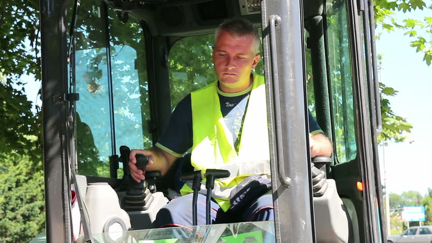 Heavy equipment operator in cabin.
 HD1080p.