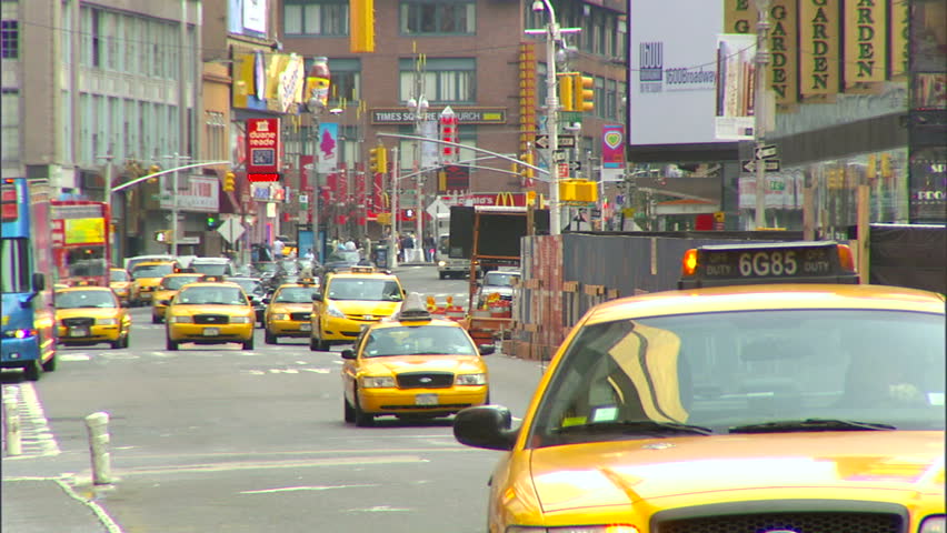 New York, NY - CIRCA 2006: Traffic goes down the street in Times Square during the day, when it is least crowded
