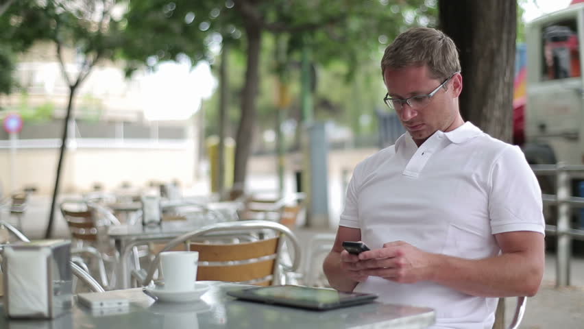 Young handsome man using smartphone, outdoors