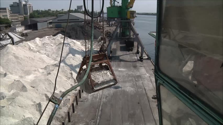 loading of sand in the sea port , time lapse