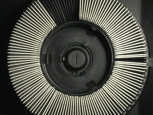 TOP VIEW OF SLIDE PROJECTOR ADVANCING