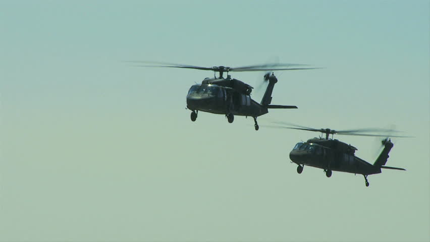 QUONSET, RHODE ISLAND - JUNE 2012: Two Blackhawk helicopters flying together at the Rhode Island National Guard Open House and Air Show in June 2012.