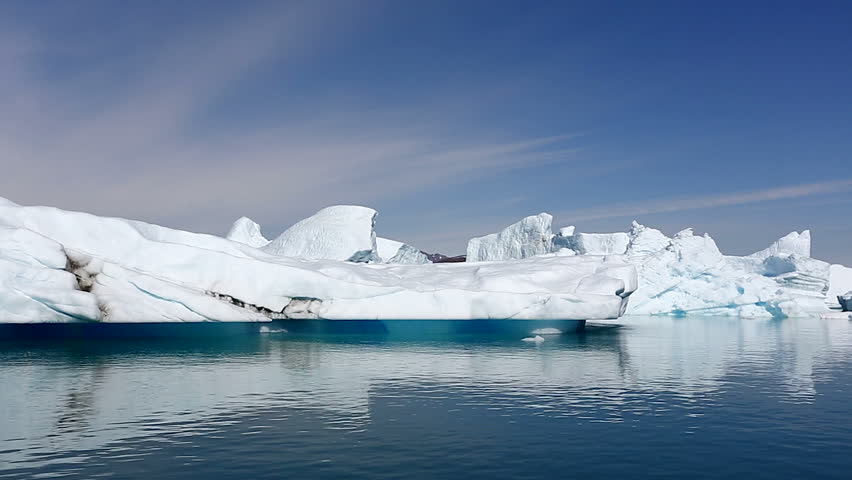 Drifting by an iceberg floating in Qooroq Icefjord, South Greenland