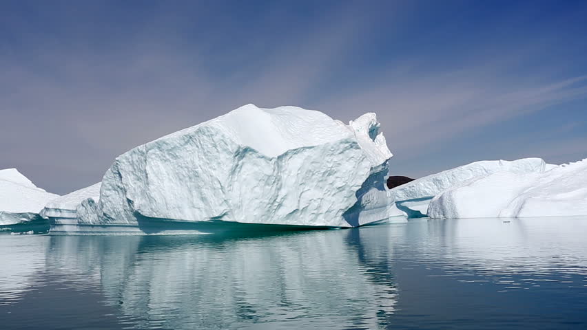 Drifting by an iceberg floating in Qooroq Icefjord, South Greenland
