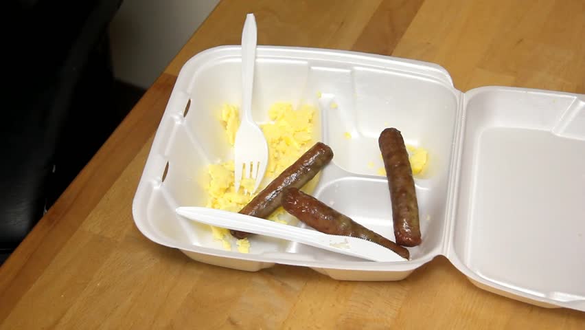 Sausage Links Slowly Removed From Styrofoam Tray With Scrambled Eggs
