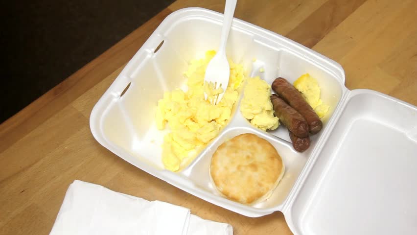 Plastic Fork Lifts Scrambled Eggs Out Of Styrofoam Tray
