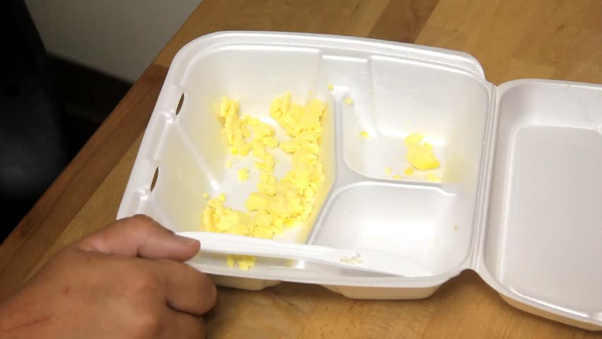 Plastic Fork Shuffles Scrambled Eggs Around In Styrofoam Tray