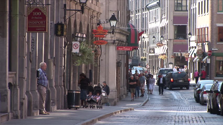 Montreal, Canada - CIRCA October 2007: People walking down a busy street in the old part of the city 