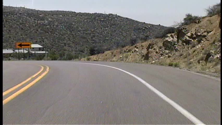 High speed run down a hill on a winding, twisty desert road in Arizona