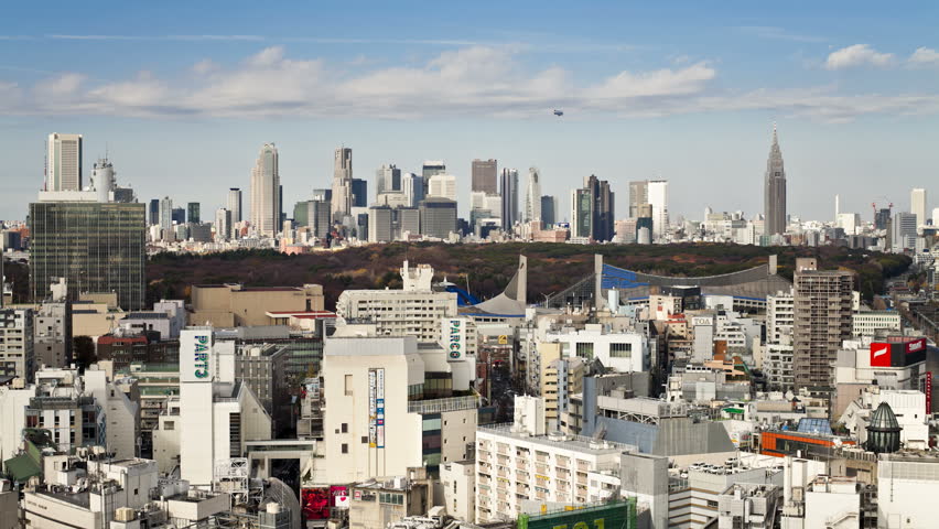 TOKYO, JAPAN - CIRCA MAY 2011: Moving clouds over Shinjuku business, shopping and entertainment district, viewed from Shibuya