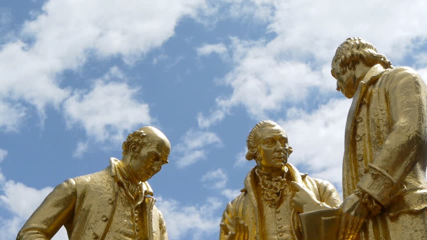 The statue of 18th Century industrialists Boulton, Watt and Murdoch in Birmingham, England.