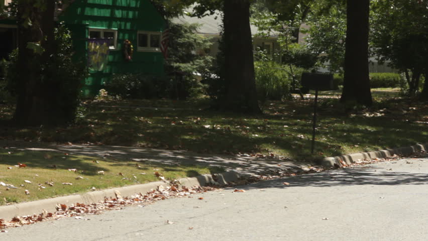 An exhausted overweight man pushing a bicycle.