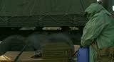 Soldier disinfecting truck