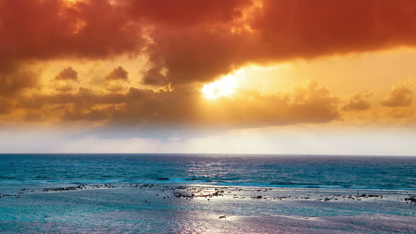 timelapse of a beautiful sunset over the caribbean sea, mexico. this version has been heavily filtered ink post to make a dreamy fantasy feel.