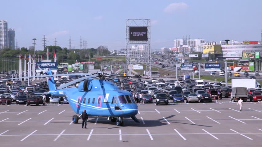 MOSCOW - MAY 21: Helicopter stands on take-off platform with rotating screw at exhibition of helicopter industry of Helirussia in Exhibition center Expo Crocus, on May 21, 2012 in Moscow, Russia