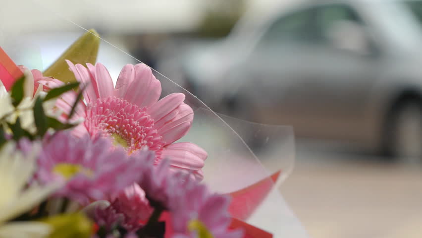 Close up of flowers on a flower seller's street stall.