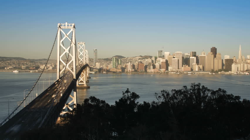 Time lapse of the San Francisco Bay Bridge and City Skyline viewed from Treasure Island, at dusk