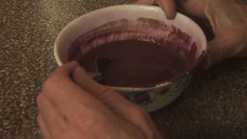 AMAZON REGION, BRAZIL - CIRCA 2010:  People eating local indigenous food made from acai berries