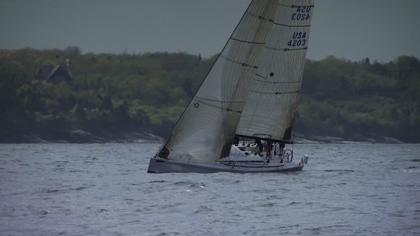 NEWPORT, RHODE ISLAND - CIRCA SEPTEMBER 2010: Sailboat moving fast in Narragansett Bay