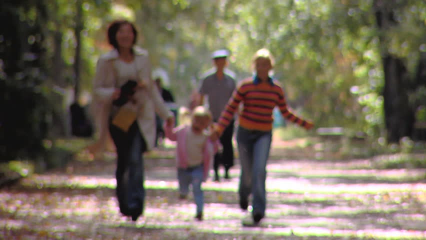 Happy mum with daughters runs to us