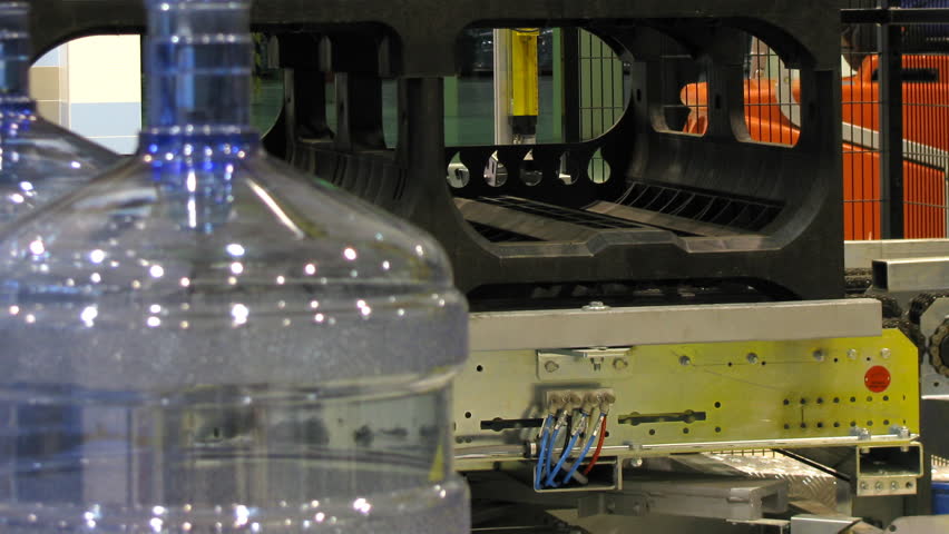 Bottled water factory. Production line. Time lapse, loopable.