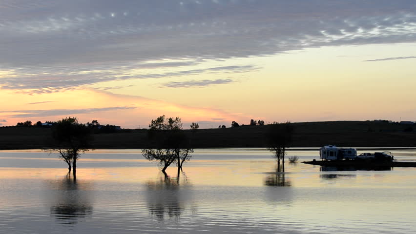 YUBA CITY, CALIFORNIA-CIRCA 2011-Campers watching the sunset from their RV at Far West Reservoir near Spenceville Wildlife Area, Yuba City, California.