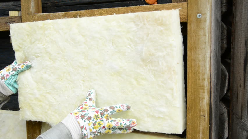 mineral rock wool insulation on ancient wooden  house wall