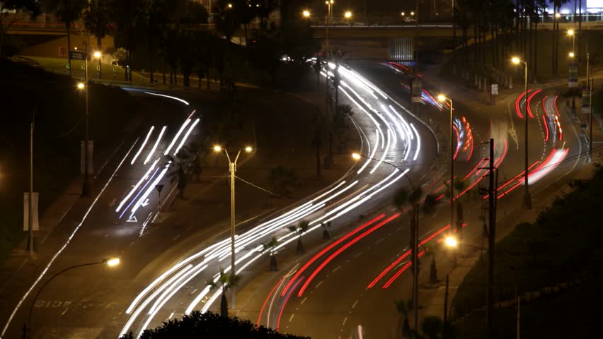 footage of traffic on a street in the city of Lima, Peru at night