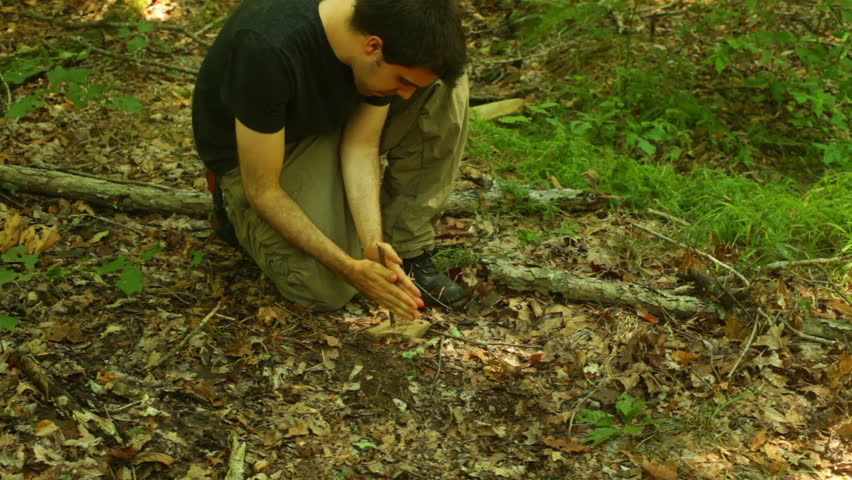 Trying to start a fire with sticks