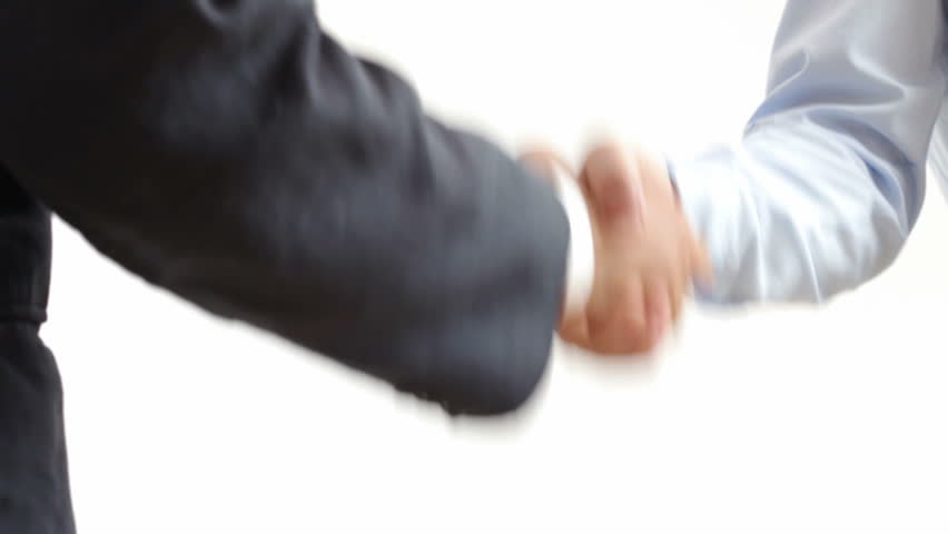 Handshake: two businessmen shaking hands