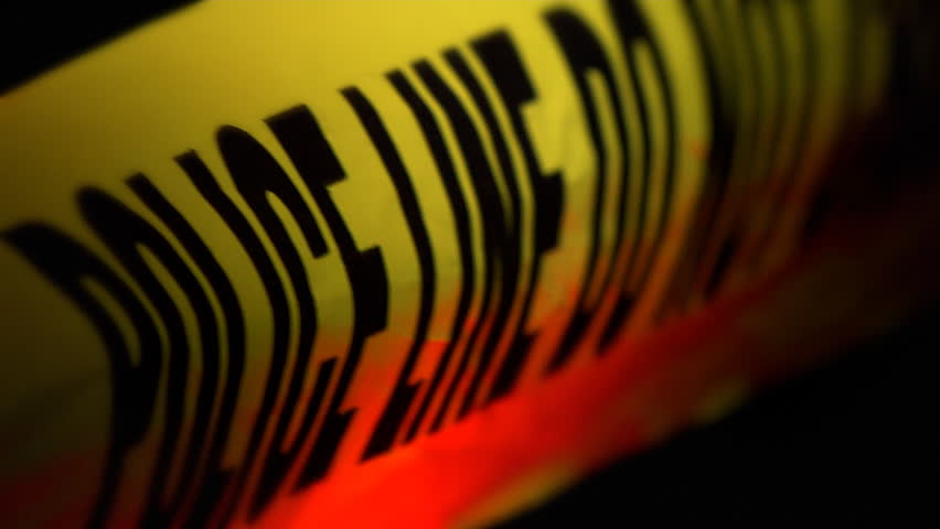 Police tape is lit up by red and blue police lights 1080 HD video