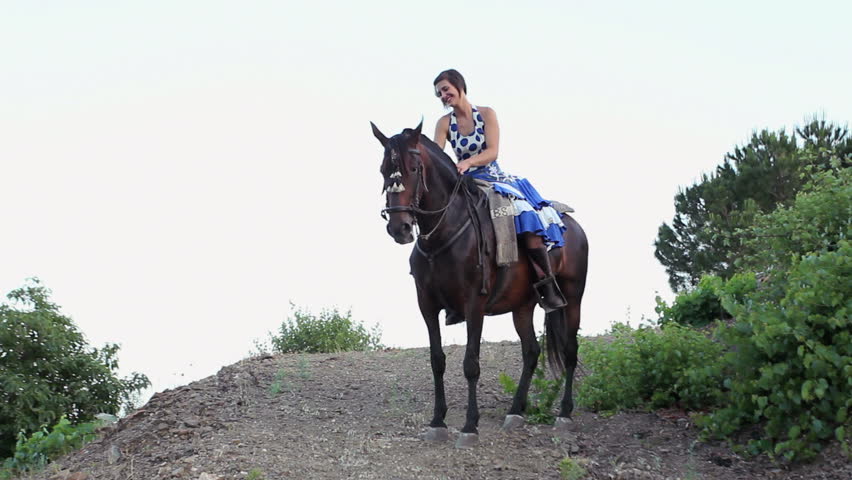 Woman riding a horse in Andalusia, Spain