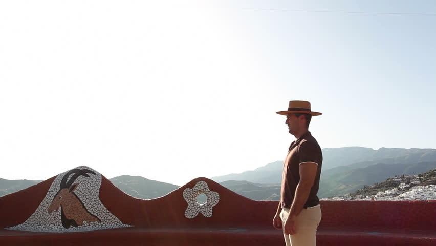 Man chatting to a woman on horseback in Andalusia, Spain