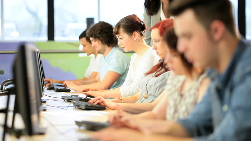 Workshop of Caucasians and Indians classmates learning with university female lecturer in modern technology class