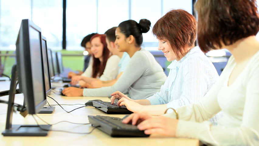 Young multi ethnic students group at university workshop e-learning