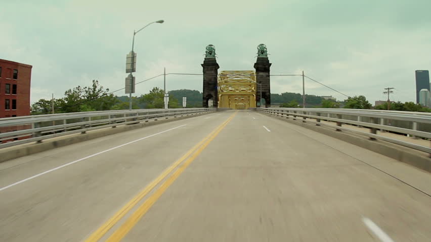 Driving on the 16th Street Bridge over the Allegheny River in Pittsburgh, Pennsylvania.  Fish eye view, camera attached to the hood of a car.