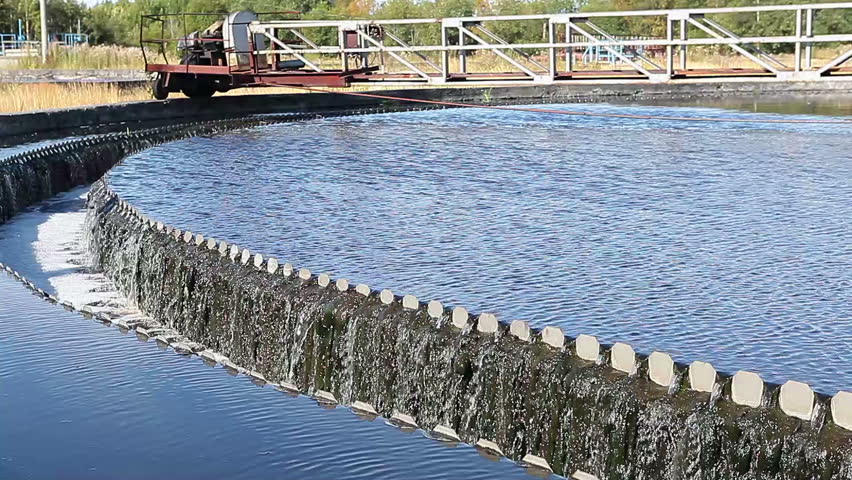 Water overflowing from round settlers on industrial sewage treatment plant