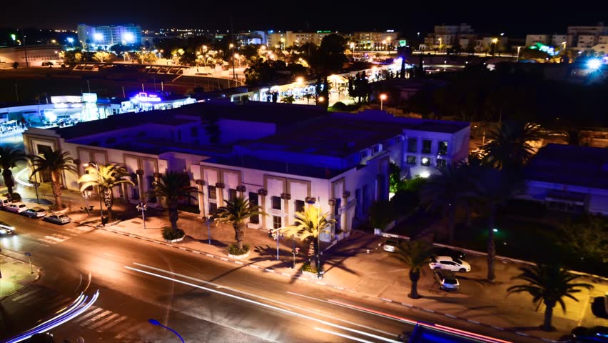 AGADIR, MOROCCO - CIRCA 2012: Time lapse of Agadir city centre at night circa July 2012 in Agadir, Morocco. Camera pan.