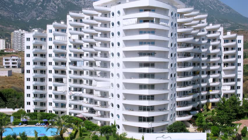 ALANYA - JUL 13: (Timelapse View) Housing estate of My Marine Residence stands against mountain landscape, on Jul 13, 2012 in Alanya, Turkey. In Housing estate of My Marine Residence 381 apartments