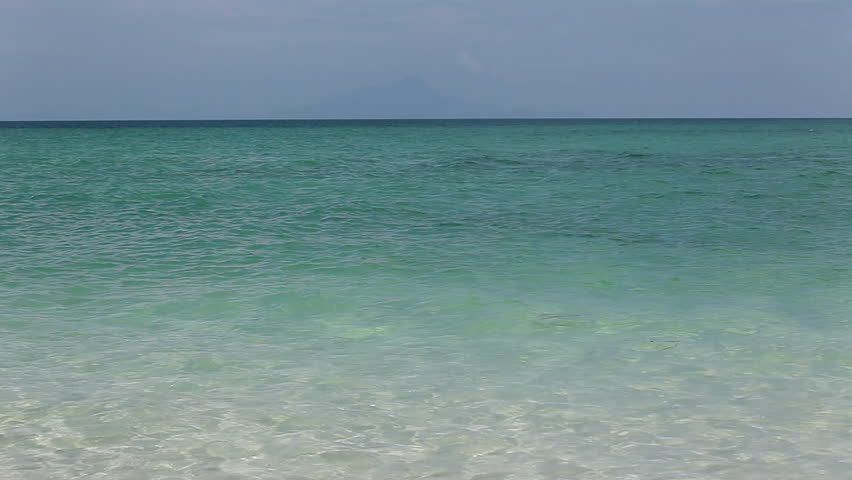 Young couple having fun in a tropical sea