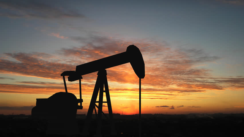Oil pump over sunrise
