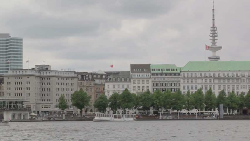 Hamgurg, Germany. River boats  with deutschland flag at Elbe river.