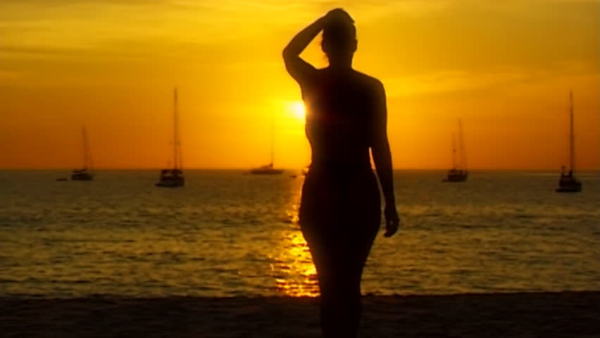 topless woman beach sundown 01soft in slow motion - slightly soft