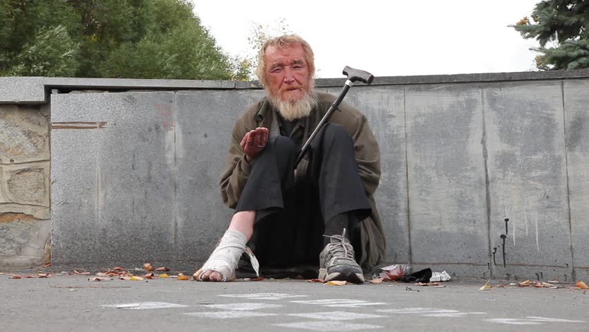 MOSSOW - SEPTEMBER 28: Homeless man sleeping on the bus stop on September 28, 2012 in Moscow, Russia