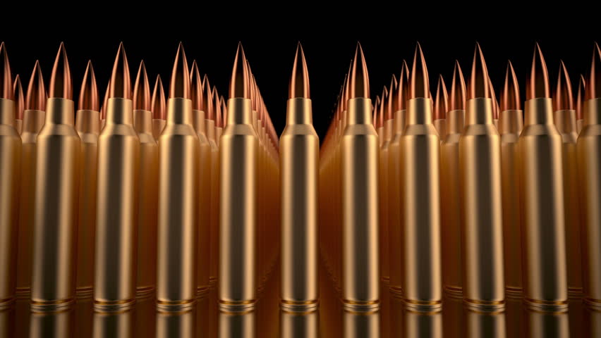 Loop of bullets lined in formation. Camera moves slowly to the left. 3d animation.