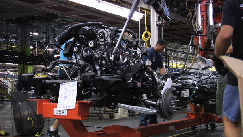ARLINGTON, TEXAS - Auto workers attaching engines to frames at the General Motors Assembly plant in Arlington, Texas, August 2007.