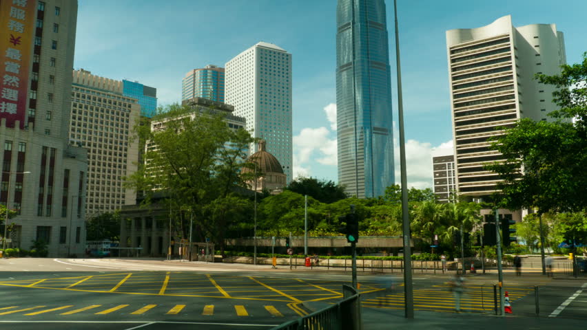 HONG KONG - SEPTEMBER 3, 2012: Busy street scene with pedestrians, cars and buses in Hong Kong, timelapse.