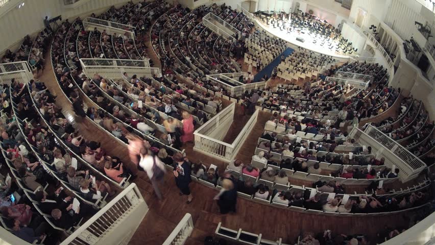 People listen to concert of classical music, time lapse