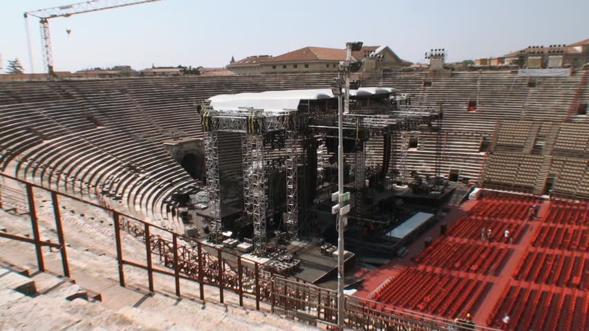 VERONA, ITALY - MAY 10:  Worksmen assembling a stage at the arena of Verona on May 10, 2012 for a concert by Tiziano Ferro. It is the second largest roman amphitheatre in the world and still in use.