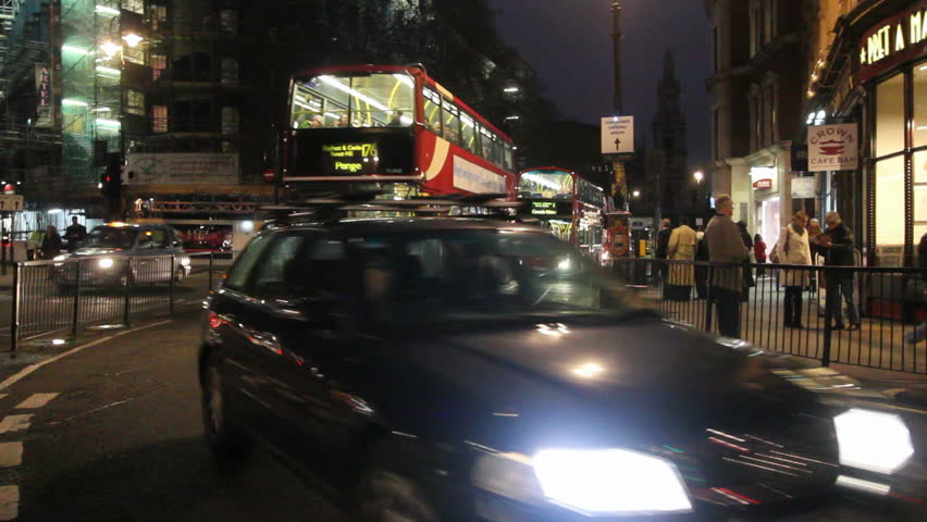 LONDON, UK - DECEMBER 27: Busses and other traffic goes by in the evening on December 27, 2011 in London, UK. 